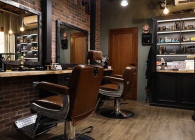 Stylish interior of Cutthroat barbershop in Stara Zagora, BG with vintage chairs and grooming products.