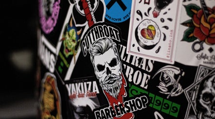 Stickers at Cutthroat, Stara Zagora, BG showcase a bold barber design with artistic flair.