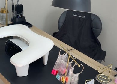 Sleek nail station at Nails by Court, Cardiff, Wales, GB with manicure tools and color samples.