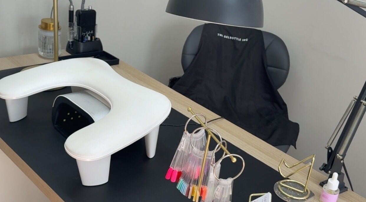 Sleek nail station at Nails by Court, Cardiff, Wales, GB with manicure tools and color samples.