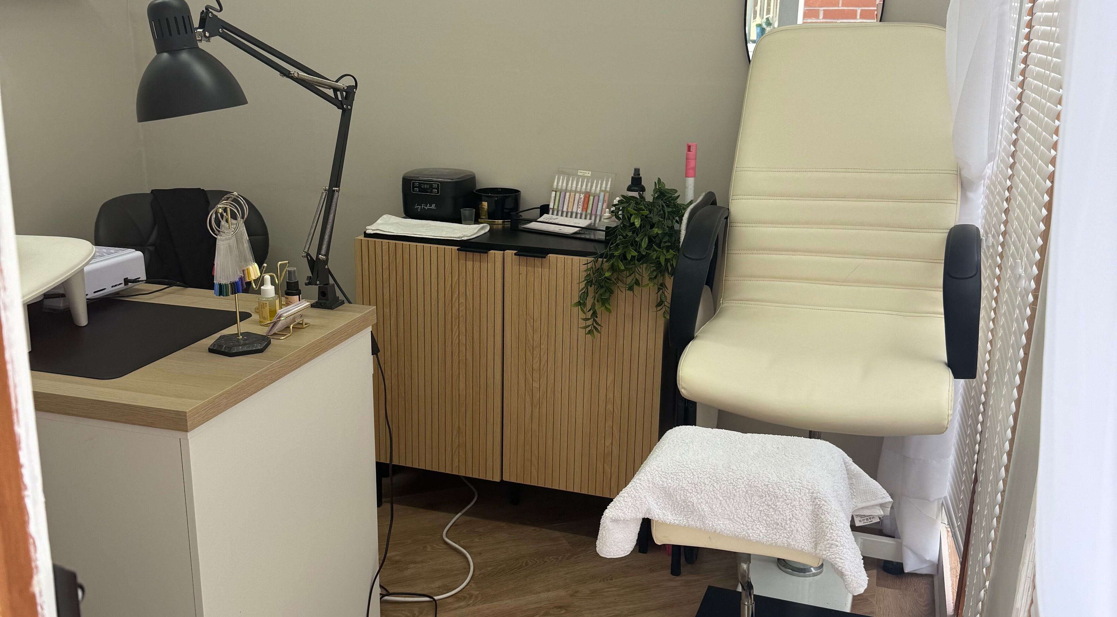 Nails by Court, Cardiff, Wales, GB: Stylish and cozy nail salon interior with modern decor.