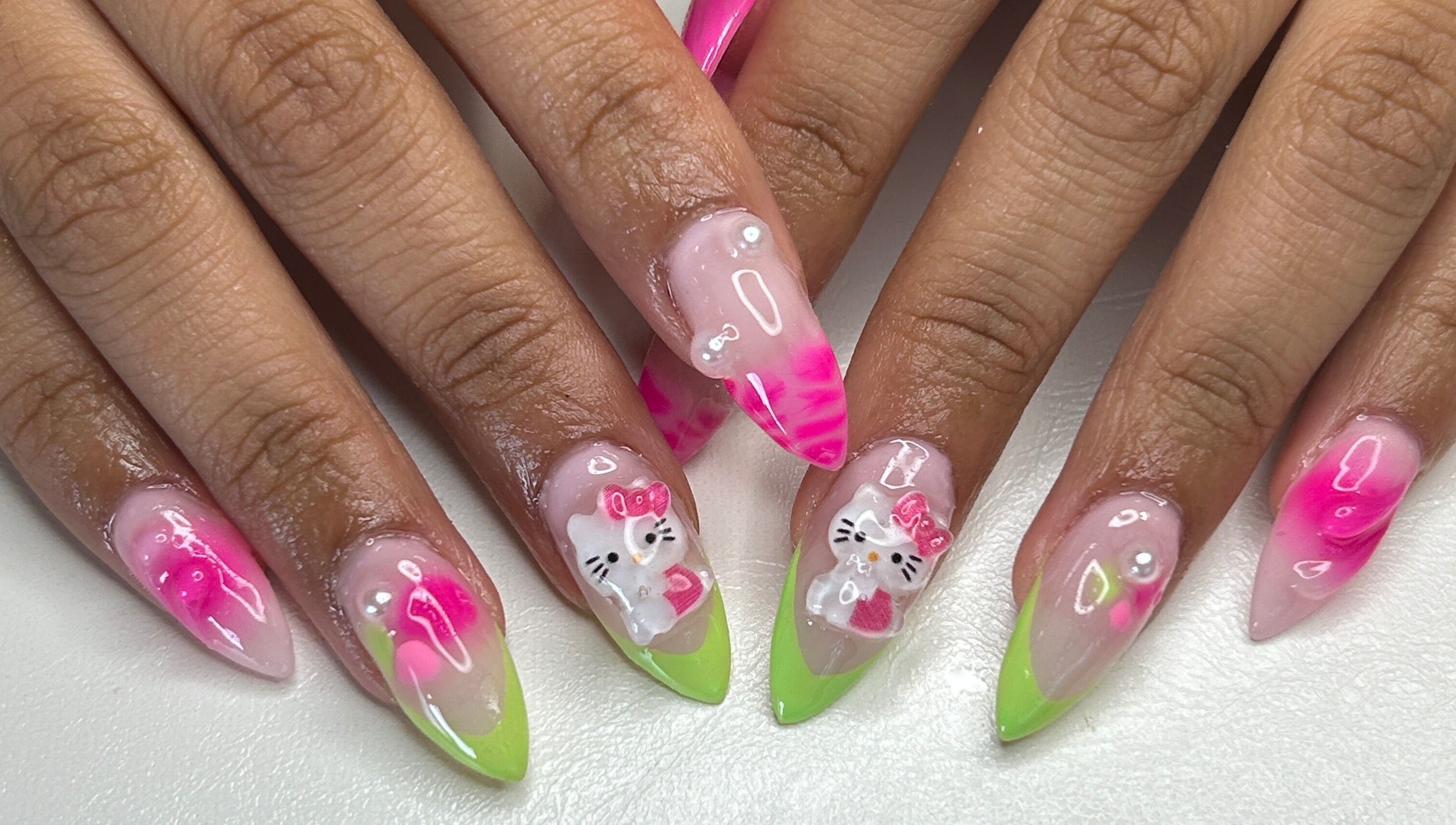 Vibrant nail art with pink and green designs at Klawed by Karissa in Vancouver, British Columbia, CA.