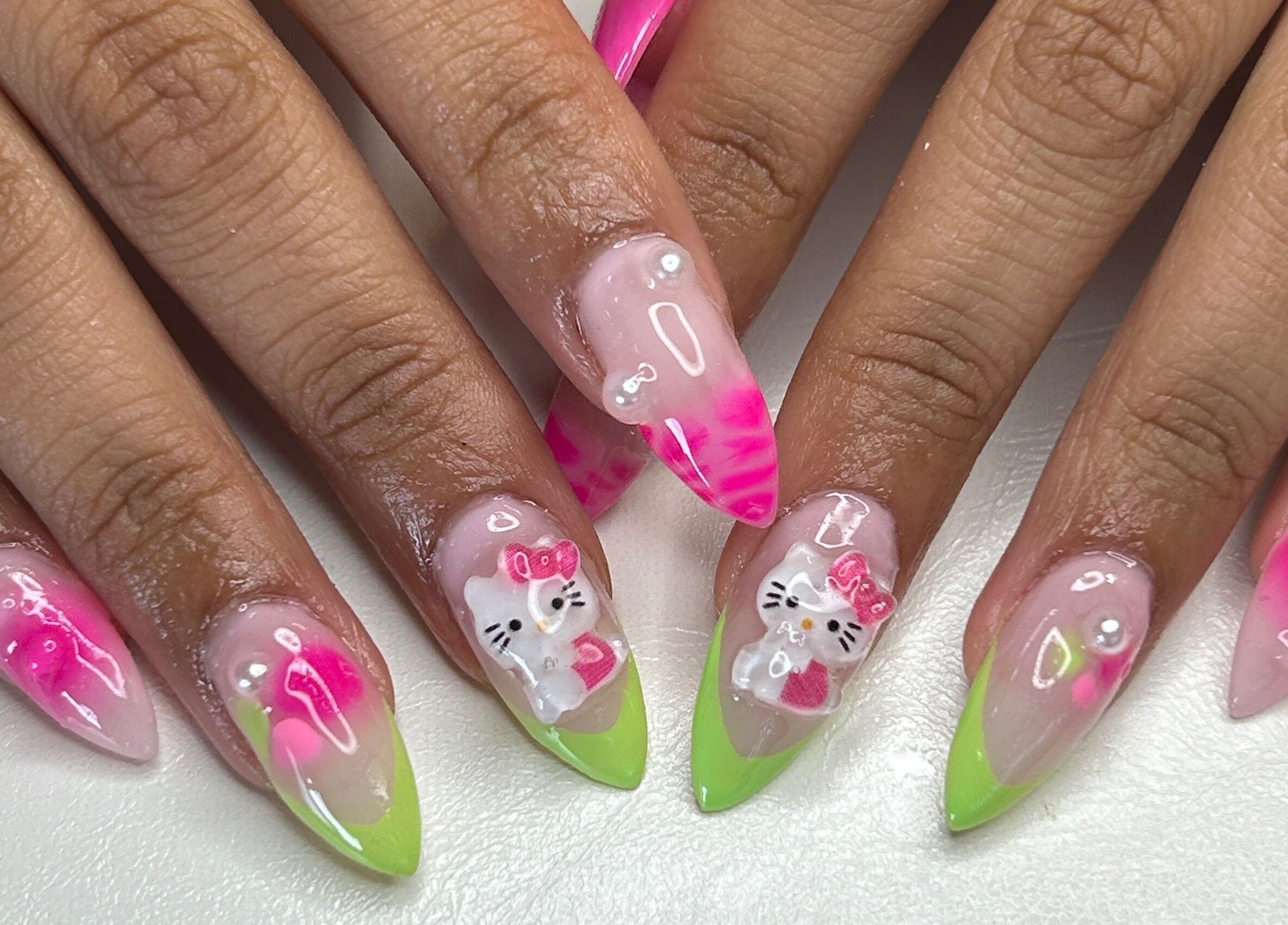 Vibrant nail art with pink and green designs at Klawed by Karissa in Vancouver, British Columbia, CA.