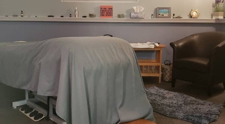 Massage room at Kokoro Therapeutics, Londonderry, New Hampshire, US with cozy setup and relaxing decor.