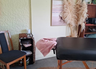 Cozy massage room at Annaste, Nelson, Nelson, NZ with a serene ambiance and comfortable treatment table.