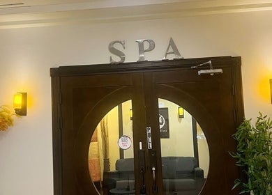 Elegant wooden doors at Beng Teng Spa, Tumon, GU welcoming guests to a serene experience.