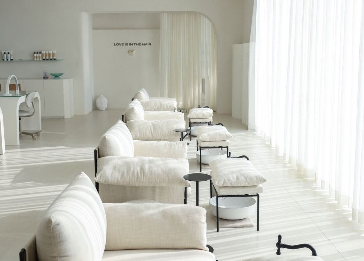 Elegant interior of MYB Lounge & Spa, Al Khobar, Eastern Province, SA with sunlight and white decor.