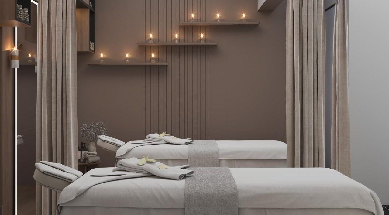 Luxurious spa room at Team Salon, الرياض, Riyadh Province, SA with massage tables and candles.