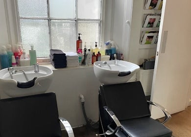 Wash stations at Fresh Men’s Hairdressers, London, England, GB, offering comfort and relaxation.