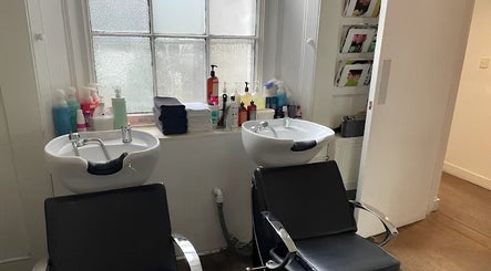 Wash stations at Fresh Men’s Hairdressers, London, England, GB, offering comfort and relaxation.