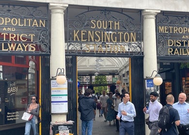 Entrance of South Kensington Station near Fresh Men’s Hairdressers, London, England, GB.