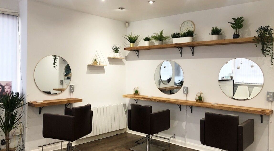 Modern salon interior at Jade The Hairstylist, Hull, England, GB featuring minimalist styling stations.