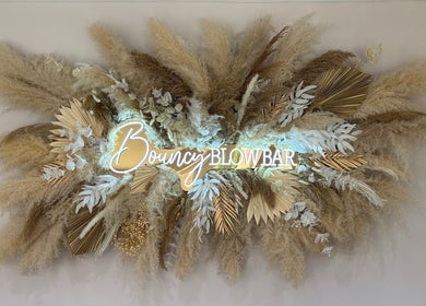 Bouncy Blowbar floral decor in Rochford, England, GB with pampas grass and golden leaves.