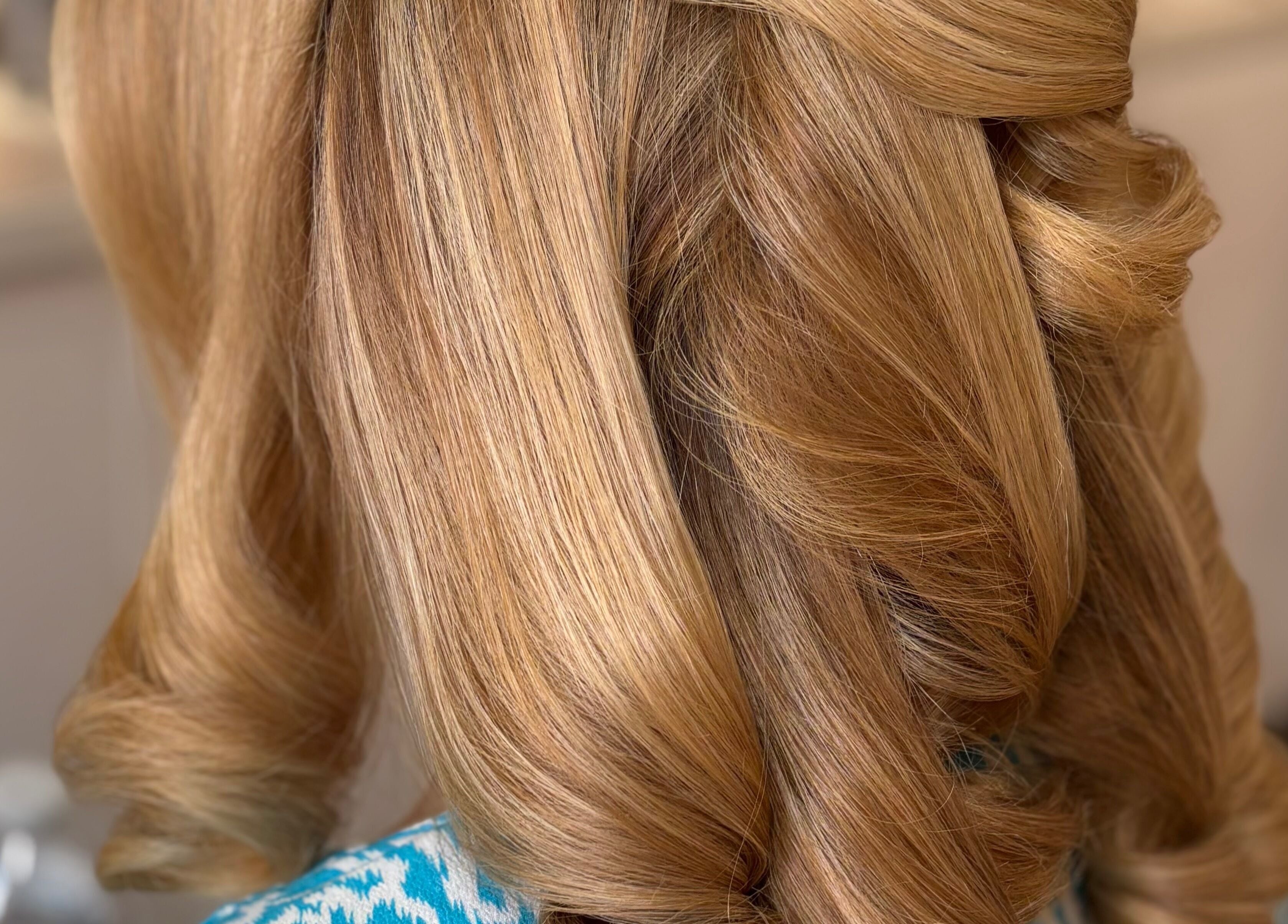 Blonde curls styled at Bouncy Blowbar, Rochford, England. Perfectly crafted for salon chic.