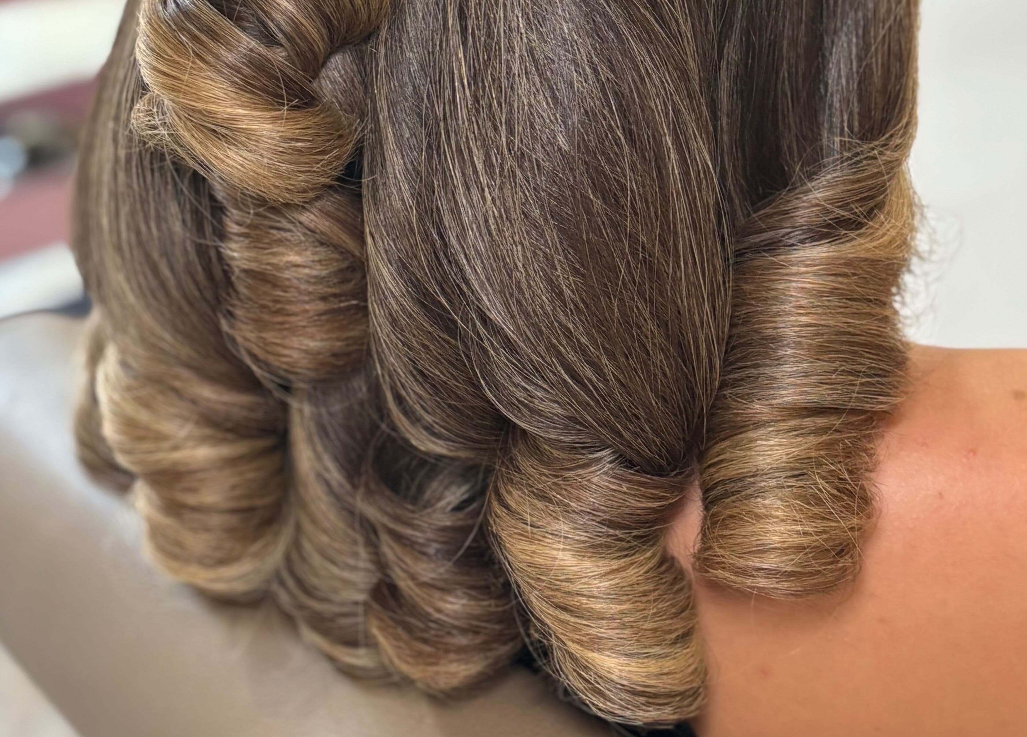 Elegant curled hairstyle at Bouncy Blowbar in Rochford, England, GB showcases professional styling excellence.