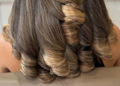 Elegant curls styled at Bouncy Blowbar, Rochford, England, GB, showcasing refined hair artistry.