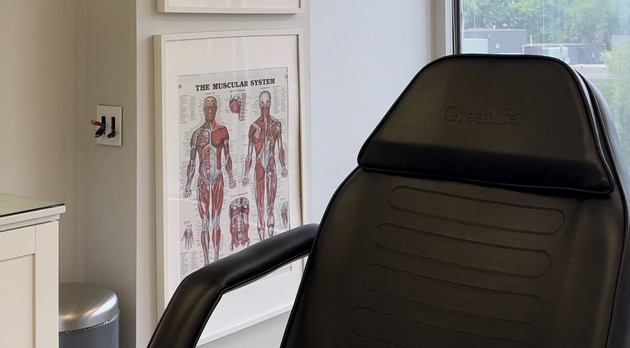 Consultation chair in Injectme.Toronto, featuring anatomical chart, Toronto, Ontario, CA.
