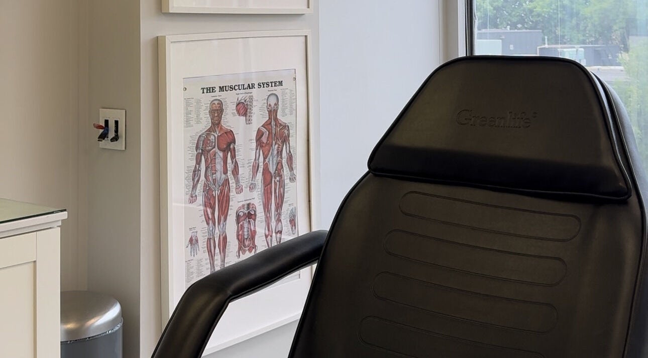 Consultation chair in Injectme.Toronto, featuring anatomical chart, Toronto, Ontario, CA.