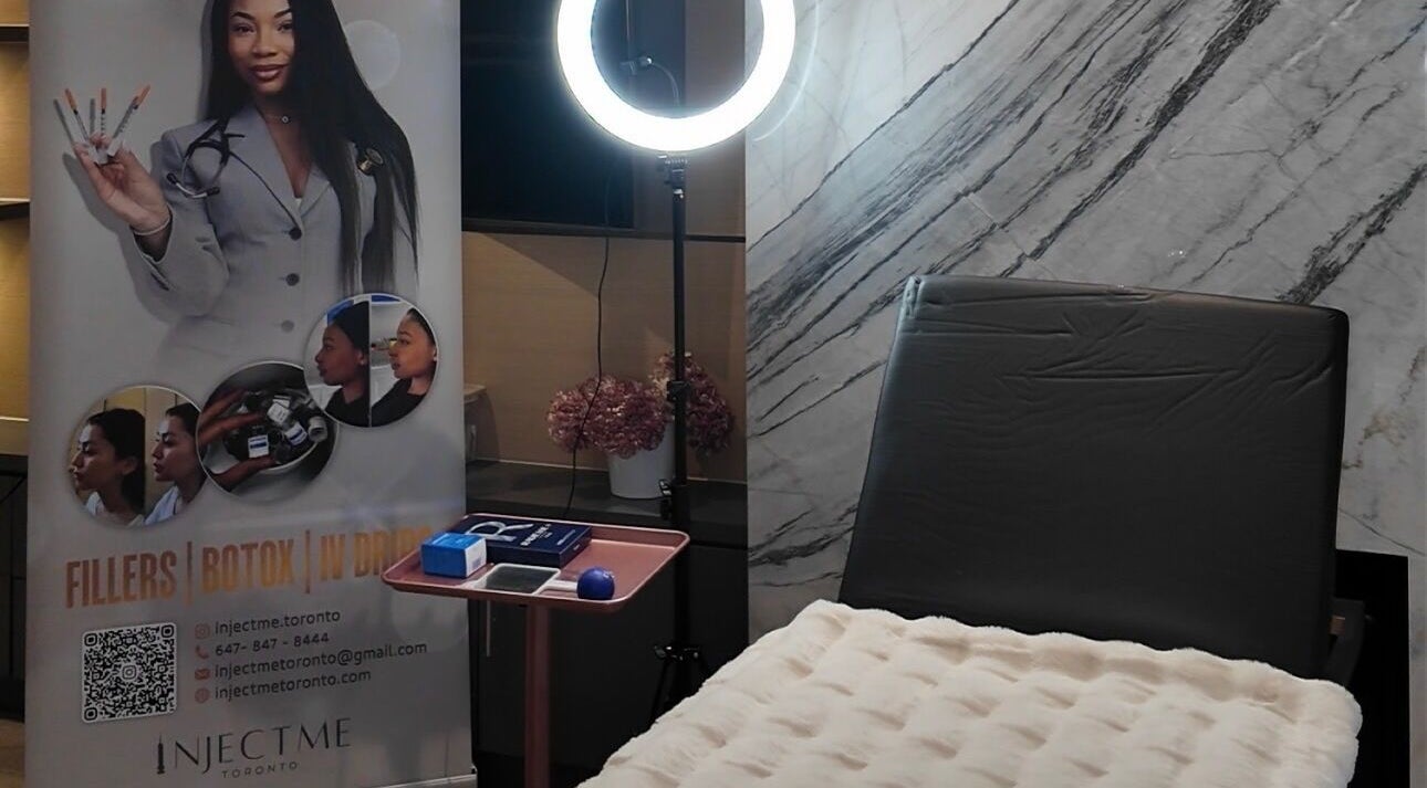 Injectme.Toronto wellness room in Toronto, Ontario, CA, featuring a modern chair and promotional display.