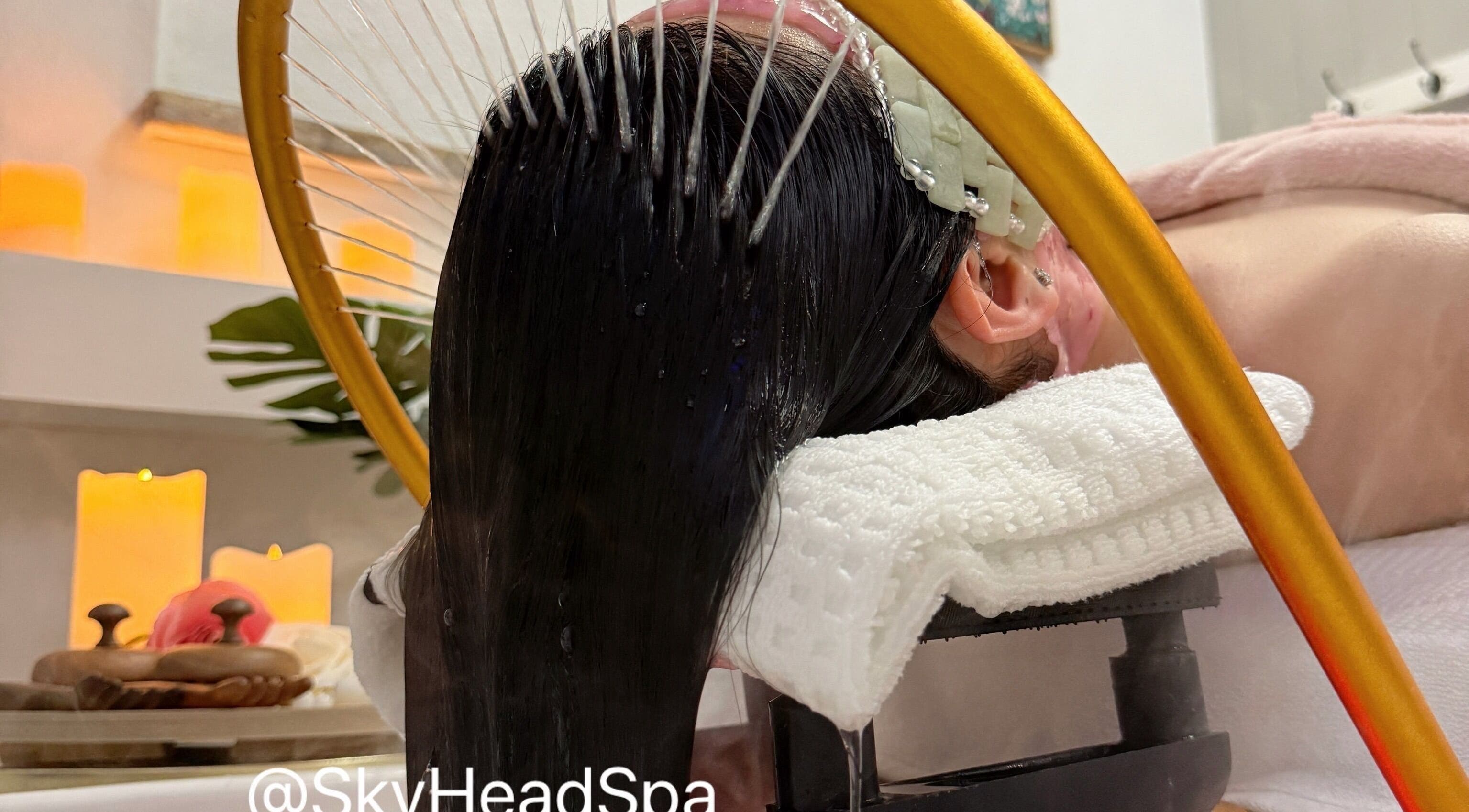 Relaxing head spa treatment at Sky Head Spa in San Jose, California, US with soothing ambiance and candlelight.