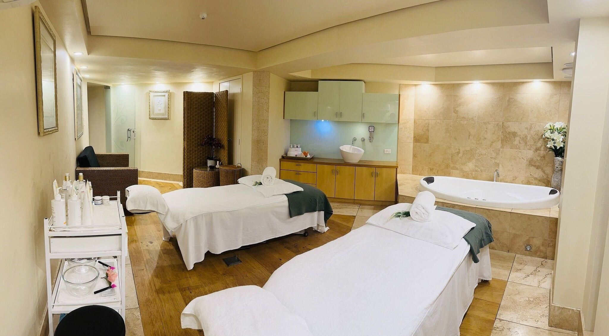 Luxurious treatment room at La Spa Naturale, Paihia, Northland, NZ, featuring cozy beds and tranquil decor.