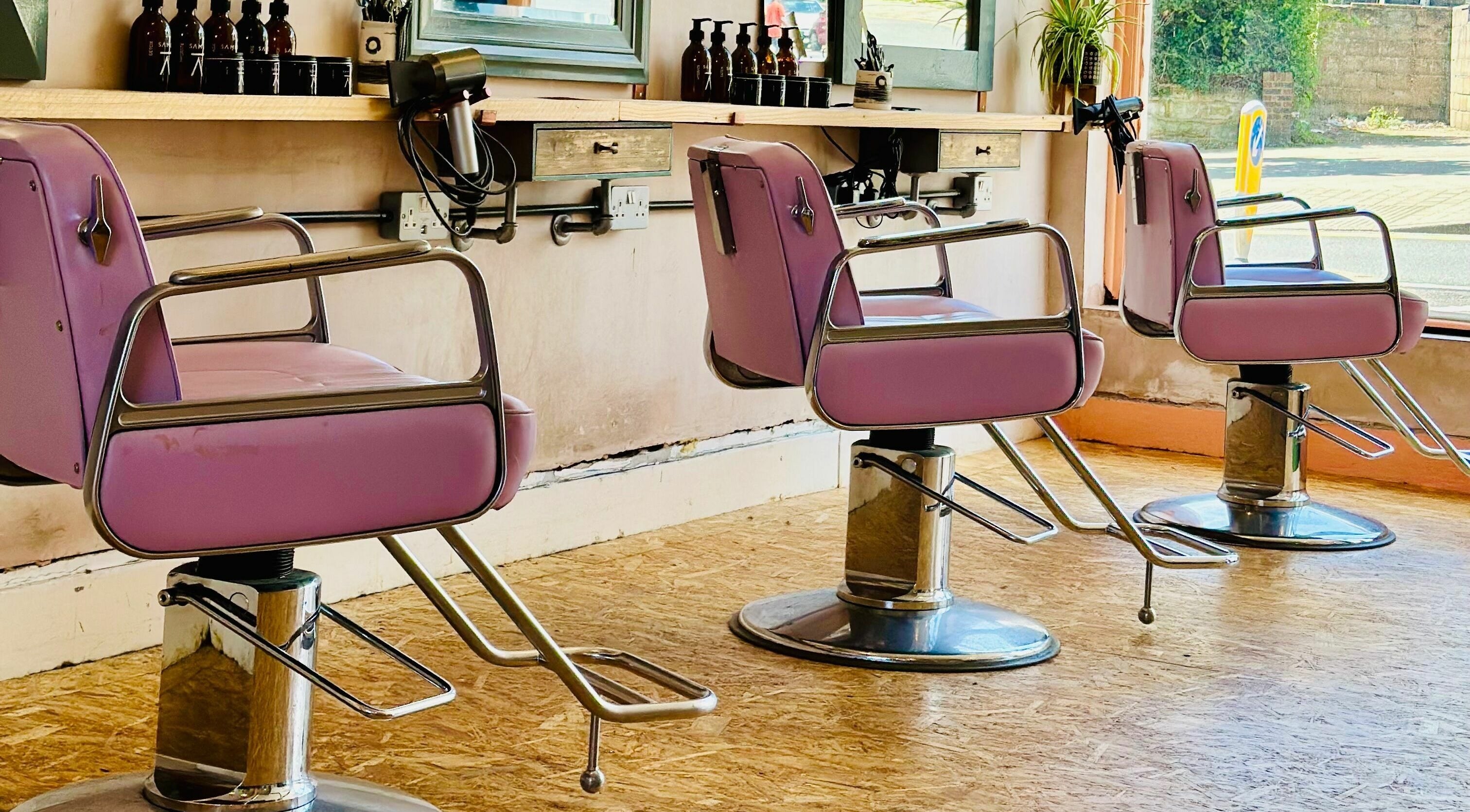 Stylish pink salon chairs at Samli, Saint Leonards-on-sea, England, GB enhance the beauty experience.