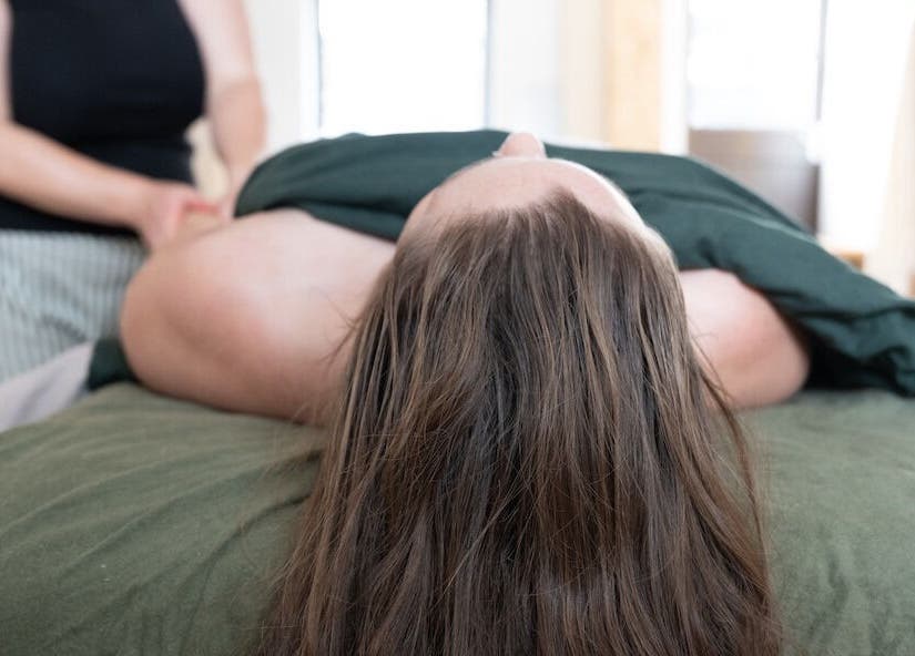 Massage therapy session at Faelt Studio in Birmingham, England, GB offers a serene wellness experience.