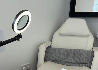 Treatment chair in Nikki Porter FHP, a serene room in Birmingham, England, GB, featuring modern lighting.