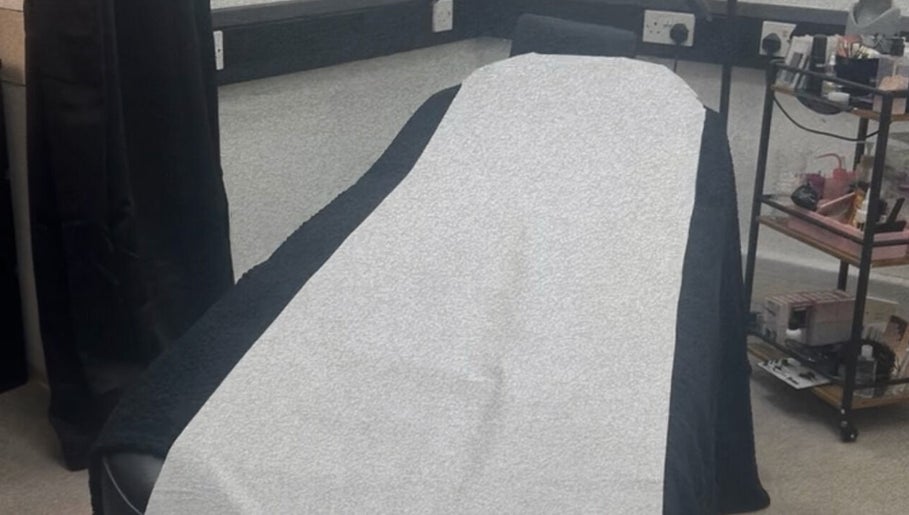 Comfortable treatment bed at Hatfield SK&CO in Hatfield, England, GB, showcasing a serene wellness space.