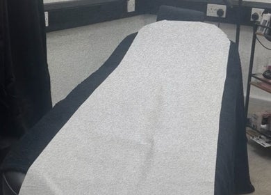 Comfortable treatment bed at Hatfield SK&CO in Hatfield, England, GB, showcasing a serene wellness space.