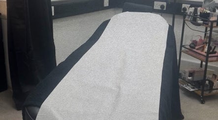 Comfortable treatment bed at Hatfield SK&CO in Hatfield, England, GB, showcasing a serene wellness space.