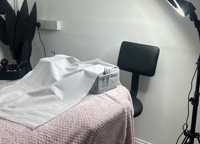 Treatment area at Halo Beauty Studio in Letchworth Garden City, England, featuring cozy decor.