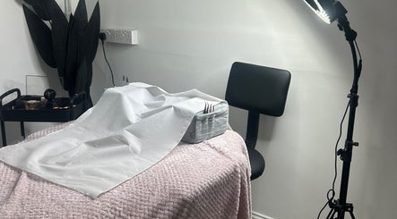 Treatment area at Halo Beauty Studio in Letchworth Garden City, England, featuring cozy decor.