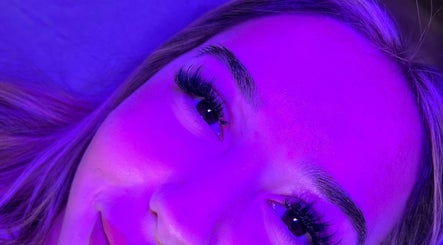 Close-up of elegant lashes enhanced under violet light at Halo Beauty Studio, Letchworth Garden City, England, GB.