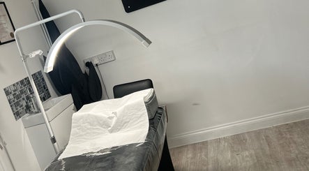 Halo Beauty Hatfield treatment room with massage bed and stylish lighting, Hatfield, England, GB.