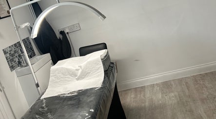 Relaxing treatment room at Halo Beauty Studio, Letchworth Garden City, England, GB, with a comfortable treatment bed.