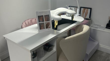 Manicure station at Halo Beauty Hatfield, Hatfield, England, GB, featuring a stylish setup with chairs and nail tools.