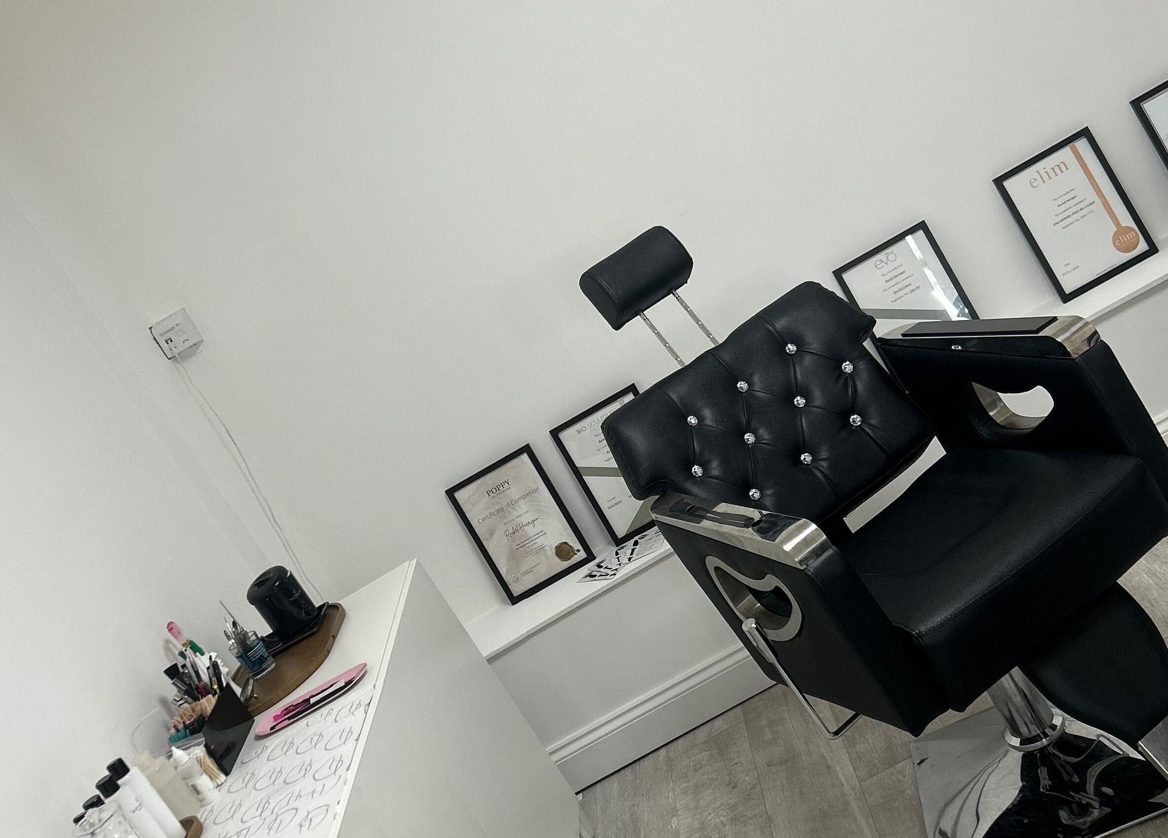 Elegant black salon chair at Halo Beauty Studio, Letchworth Garden City, England, GB.
