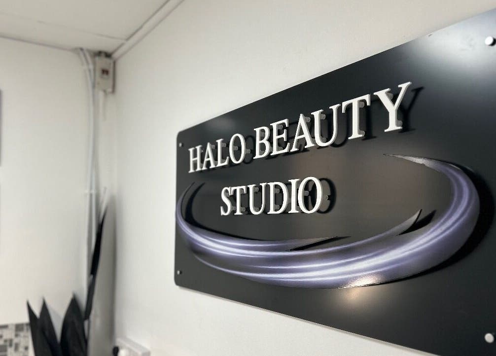 Halo Beauty Studio sign at Letchworth Garden City, England, GB, showcasing elegant studio decor.