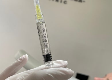 A gloved hand holds a syringe at Kolcheva Skin & Laser Clinic, Kirkham, England, GB.