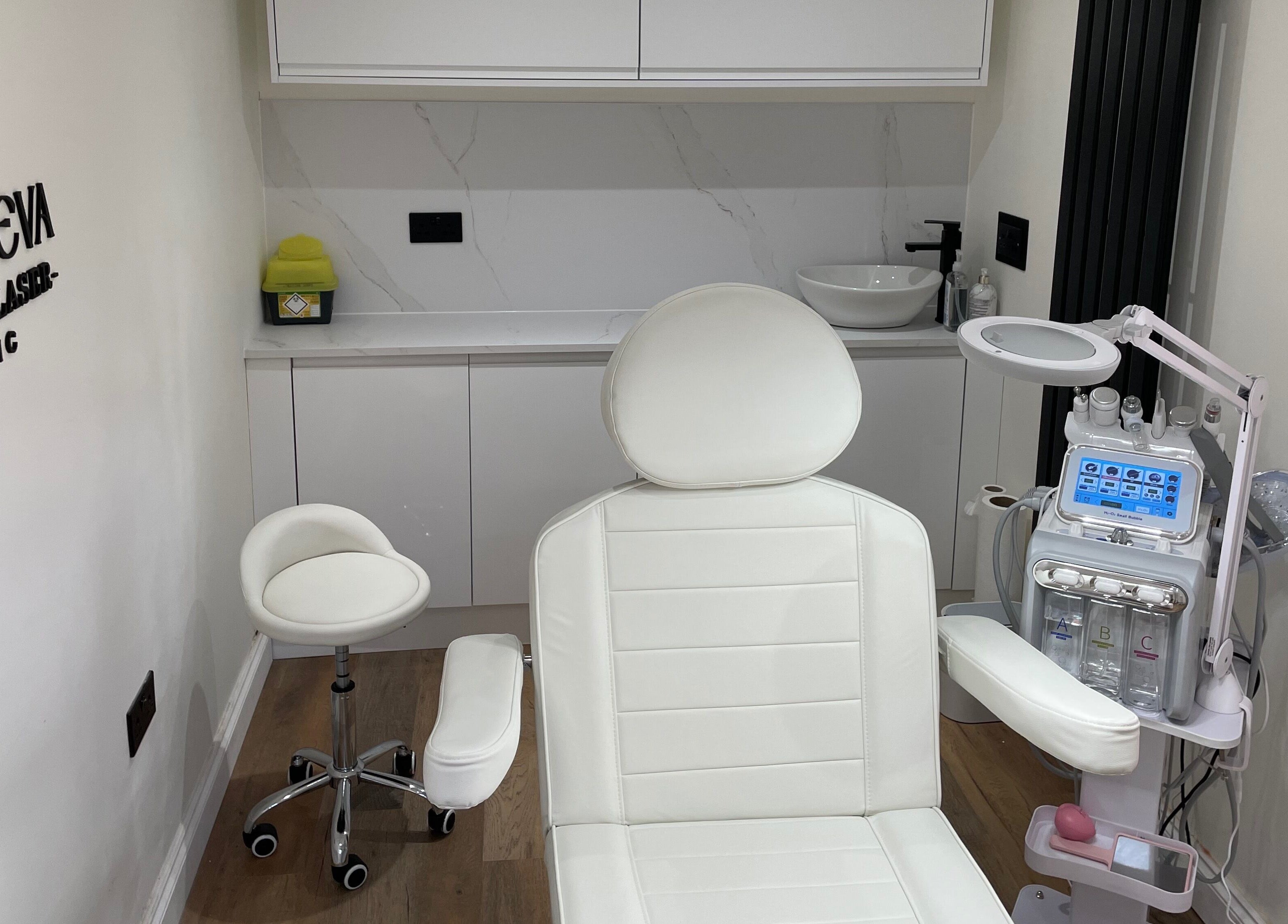 Massage chair in Kolcheva Skin & Laser Clinic, Kirkham, England, GB, with equipment and decor.