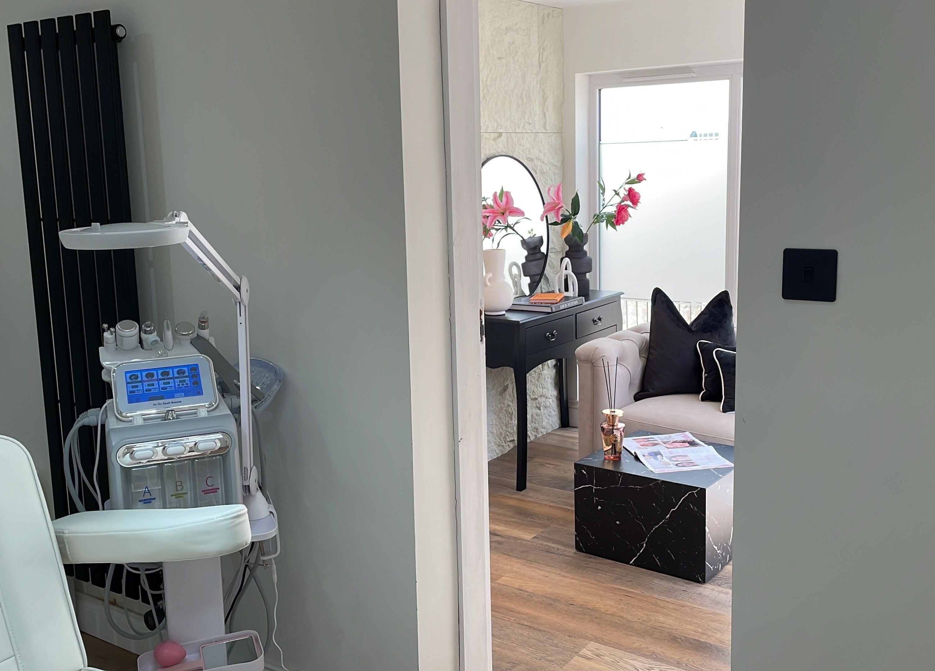 Sophisticated interior of Kolcheva Skin & Laser Clinic in Kirkham, England, GB, showcasing a treatment room and seating area.