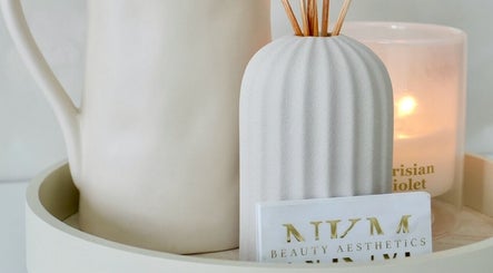 Serene ambience at By Nicole Kayleigh in Fleetwood, England, GB with candle and diffuser on tray.