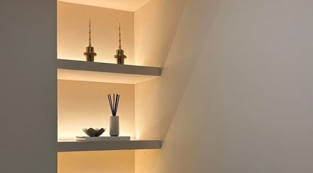Elegant shelf decor at The Beauty Shack @ Muse Studio, Longwell Green, England, GB with candles and diffuser.