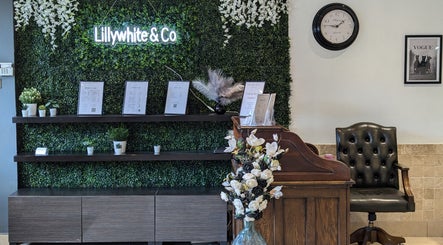 Reception area at Bex at Lillywhite & Co. in Wakefield, England, GB with lush greenery backdrop and stylish decor.