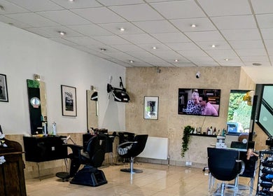 Chic salon interior of Bex at Lillywhite & Co. in Wakefield, England, GB. Modern decor with hair styling stations.