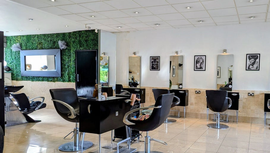 Modern salon interior at Bex at Lillywhite & Co., Wakefield, England, GB with stylish chairs and wall art.
