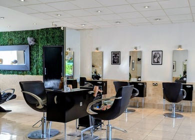 Modern salon interior at Bex at Lillywhite & Co., Wakefield, England, GB with stylish chairs and wall art.