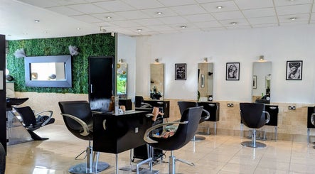Modern salon interior at Bex at Lillywhite & Co., Wakefield, England, GB with stylish chairs and wall art.