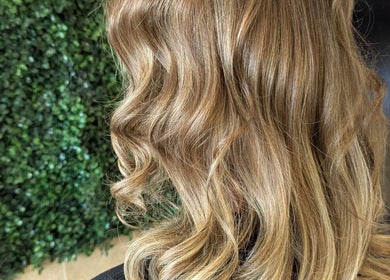 Elegant wavy blonde hair styled at Bex at Lillywhite & Co., Wakefield, England, GB.